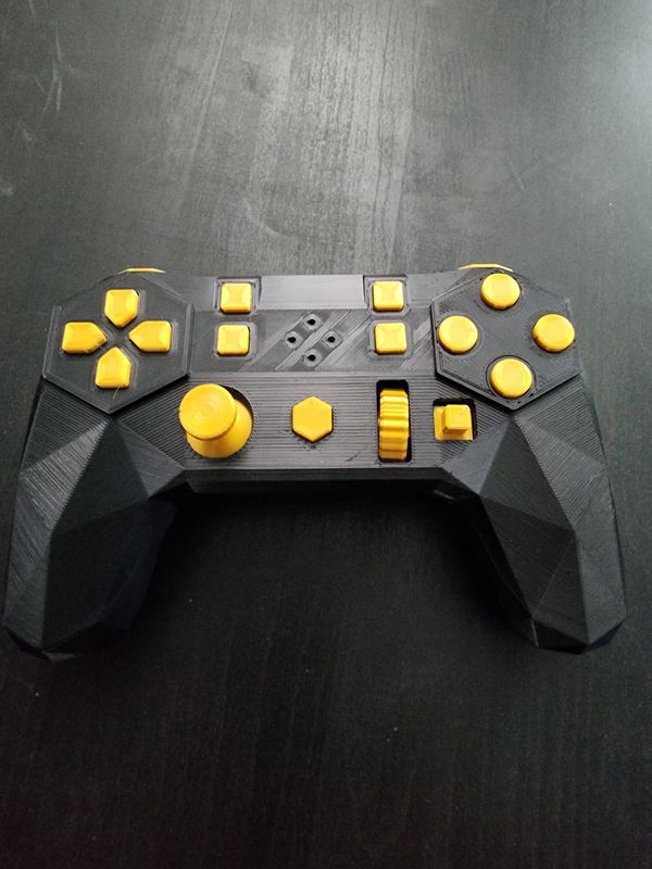 Photo of the Input Labs Alpakka Controller, black body yellow buttons