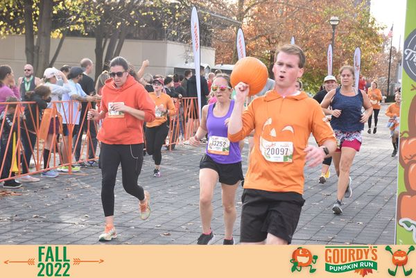 Photo of me running while carrying a 5lb pumpkin over my shoulder