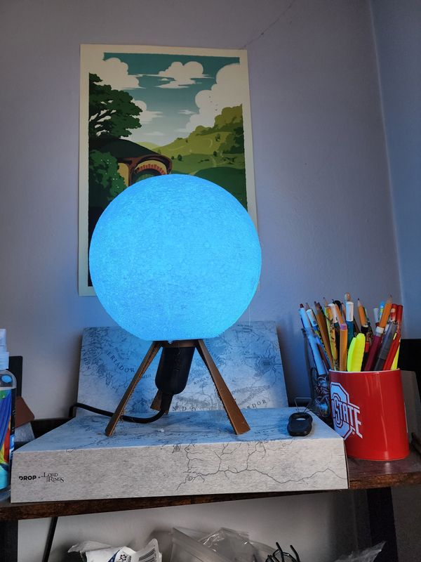 Photo of the moon lamp with a bulb colored blue inside